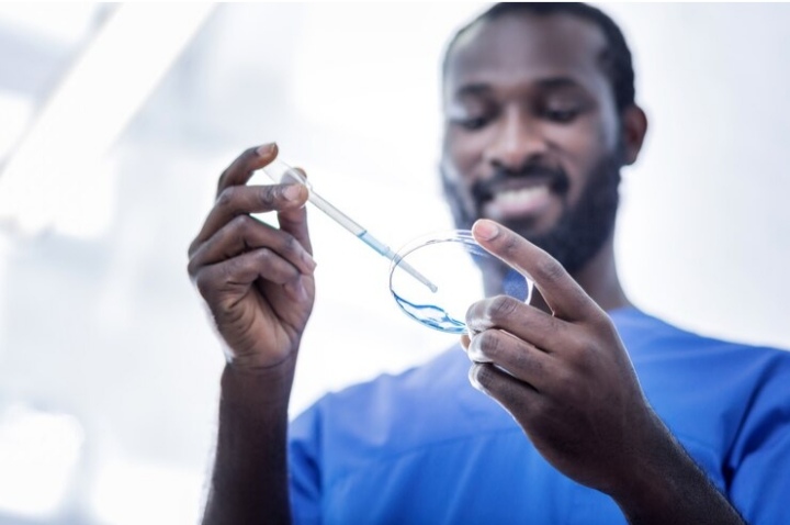 Optometrist fitting a contact lens on a patient's eye